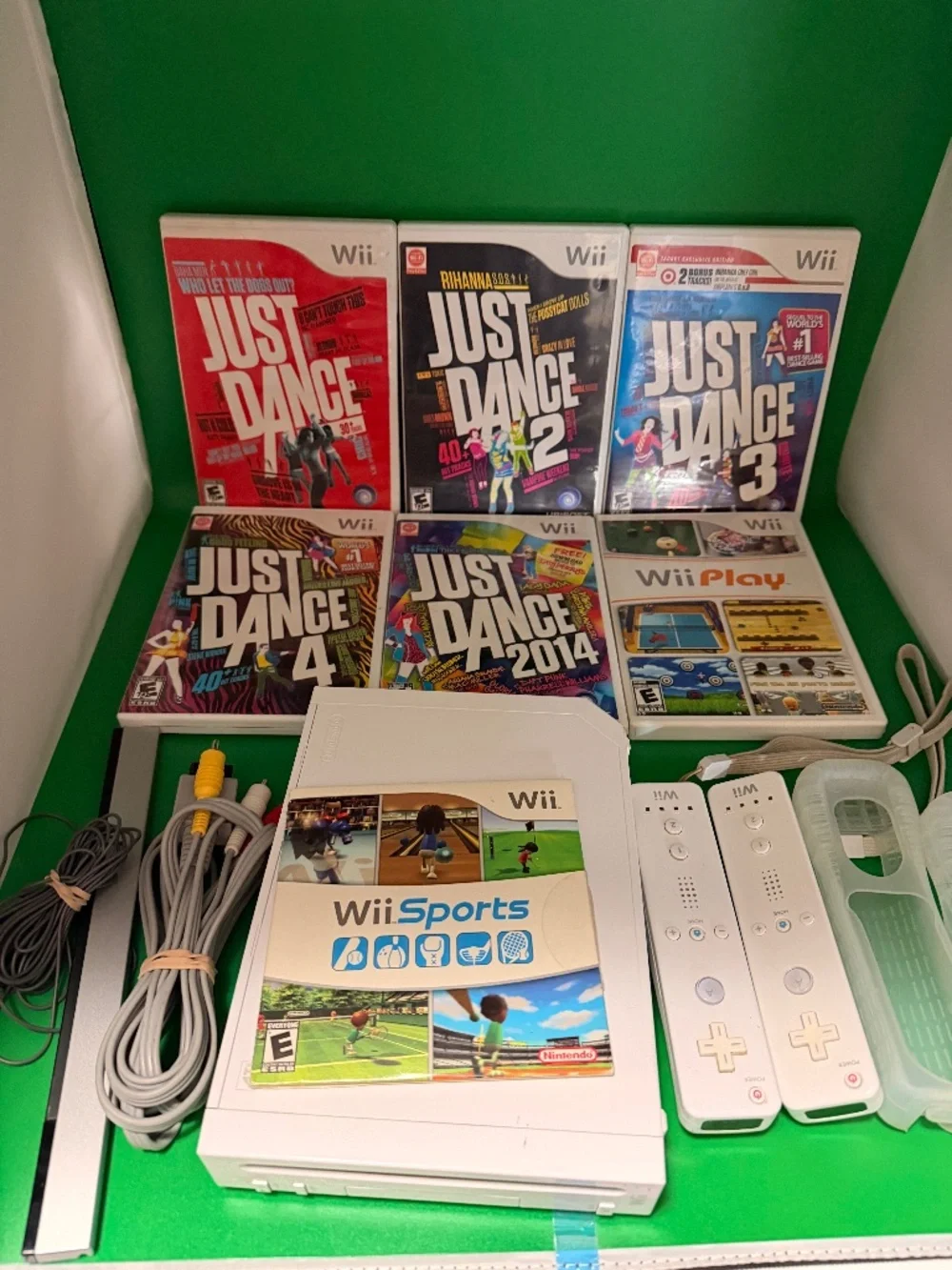 Nintendo Wii Console with Wii Sports and Just Dance lot